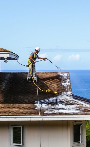 worker rejuvenating roof